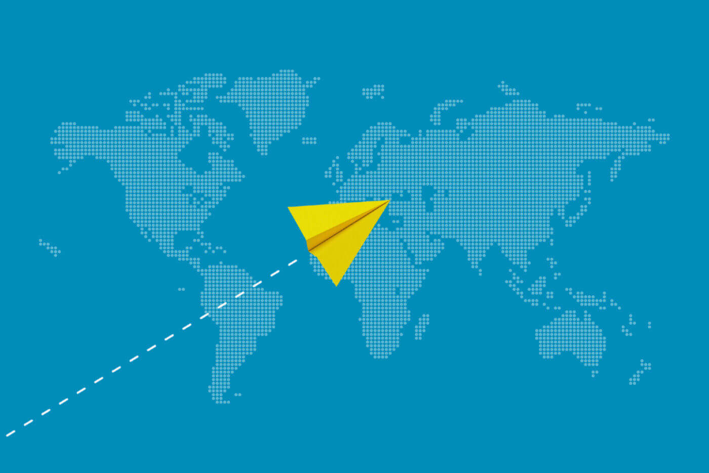 Yellow paper plane flying across a world map representing international communication and connection.