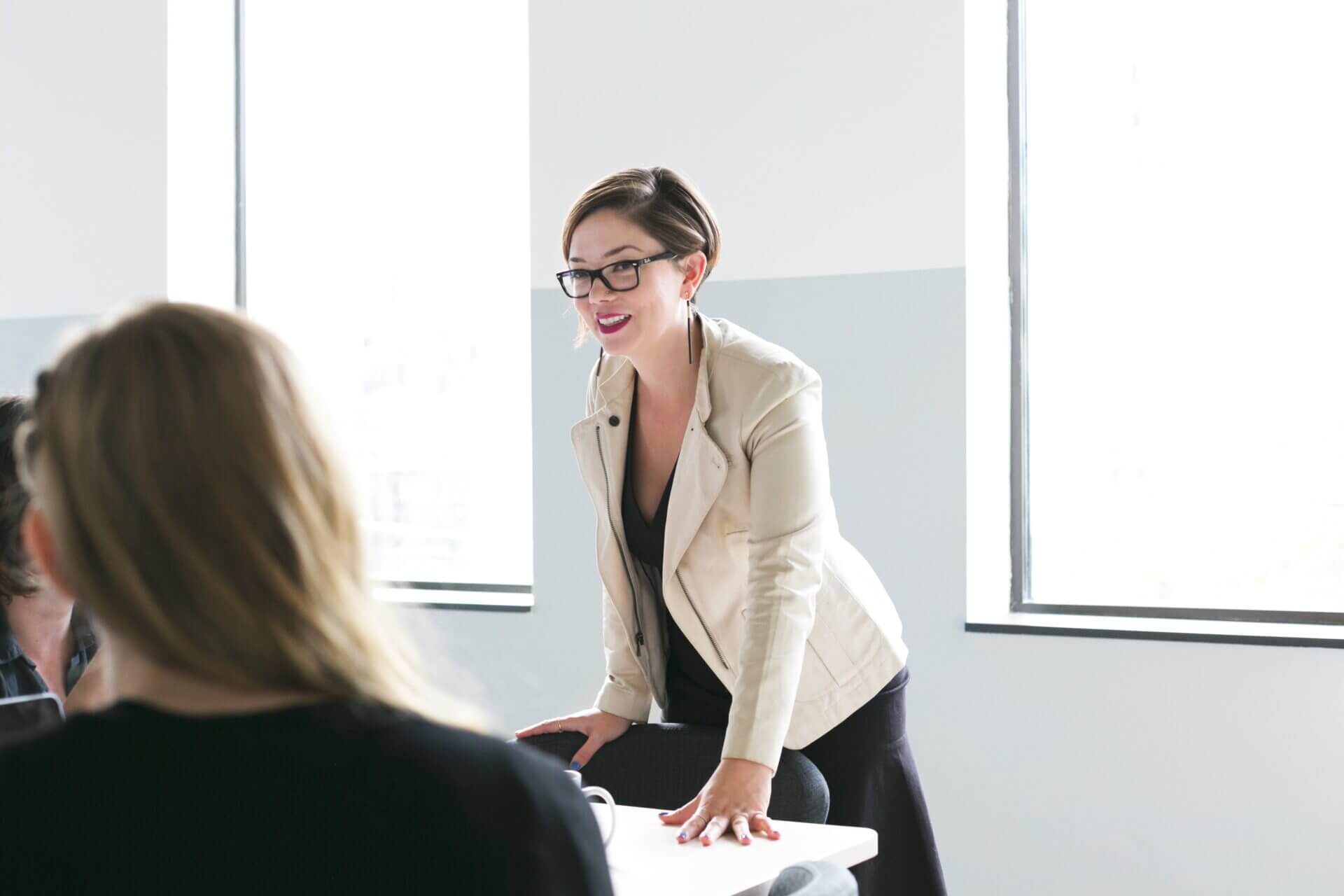 Trainer leading a group discussion during a professional development workshop.